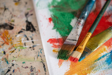 Obraz premium painting lessons, canvas with paints, brushes and other elements for painting