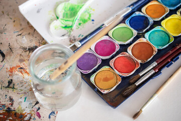 painting lessons, canvas with paints, brushes and other elements for painting