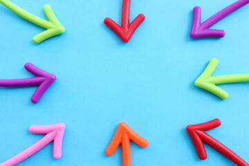 Colorful arrows creating frame on blue background