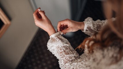 Bride getting ready. Close up of wedding details, bride's hands