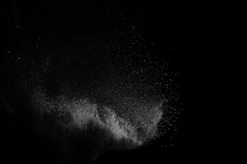 Abstract white dust on black background. Light smoke texture. Powder explosion. Splash water overlay.	