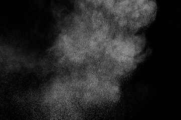 Abstract white dust on black background. Light smoke texture. Powder explosion. Splash water...