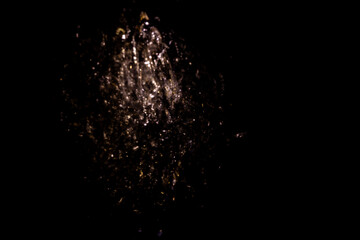 abstract golden lights on black background. blurred party lights.