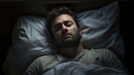 Man trying to sleep, but with visible tension and anxiety on his face.