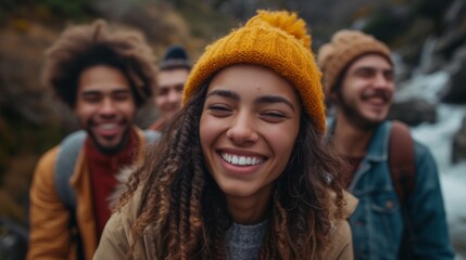 Fototapeta premium Group of cheerful young friends hiking in nature, enjoying a lively adventure