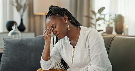 Headache, burnout and young black woman in the living room of her modern apartment on weekend. Stress, mental health and sick African female person with migraine for illness in lounge at home. - obrazy, fototapety, plakaty