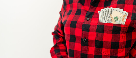 Money transfers banner. Female person with dollar bills in pocket of her red shirt.