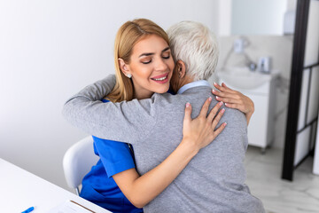 The elderly woman enjoys an embrace from her favorite healthcare doctor. Medical care, young female...