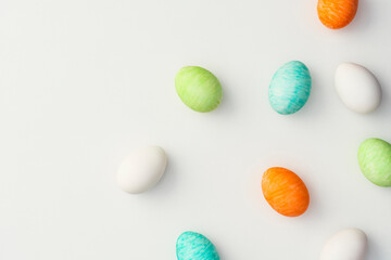 Hand painted colourful easter eggs on white background.
