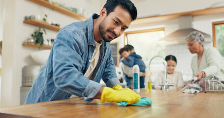 Family, cleaning and man in a kitchen with cloth for table, hygiene or clean living space after...