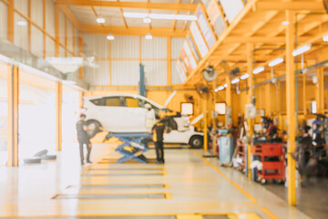 Garage car service center mechanic team worker working fix maintenance vehicle blur for background