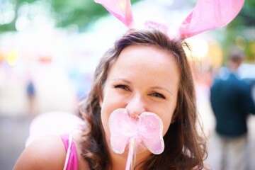 Portrait, outdoor and woman with bunny ears, costume and party with fun and social gathering. Face,...