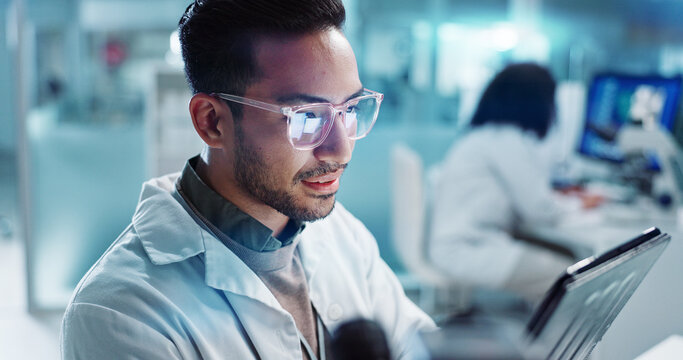 Tablet, scientist and happy for analysis in laboratory, healthcare and reading of online pharmaceutical research. Asian expert, technology or connection for innovation or information in biotechnology