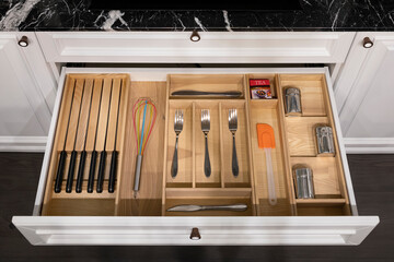 Wood kitchen drawer organizer, utensil holder with simple set of kitchen tools, furniture details