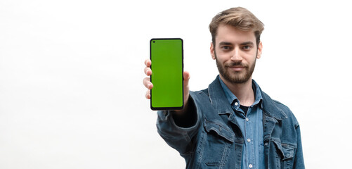 young man showing smart phone screen