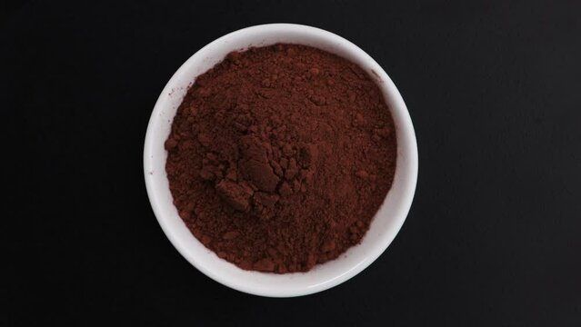cacao powder top view on black