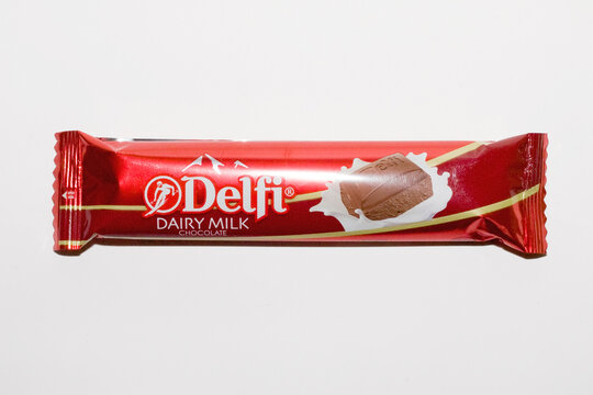 Close up a pack of Delfi Dairy Milk Chocolate isolated on white background. front view