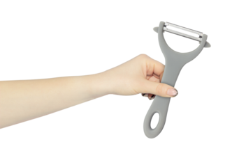 vegetable peele in hand, outstretched hand with vegetable peele isolated from background