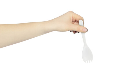plastic spoon-fork in hand, outstretched hand with plastic spoon-fork isolated from background