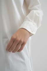 A person wearing a white shirt and tie. Suitable for professional and formal occasions