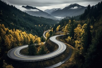 Winding road in the autumn forest. The concept of active and extreme tourism