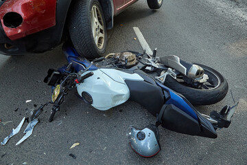 Damaged motobike and  a car in a accident - obrazy, fototapety, plakaty