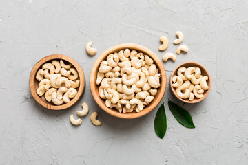 cashew nuts in wooden bowl on table background. top view. Space for text Healthy food