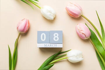 8 March, International Women's Day. greeting card design with tulips and calendar top view, with...