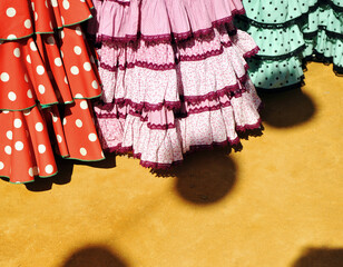 Flamenco dresses (vestidos de flamenca) in Fair of Seville. Typical women dresses for Seville Fair.