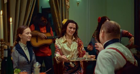 gypsy woman serving vodka to aristocratic pair in restaurant in 19 century, 4K, Prores