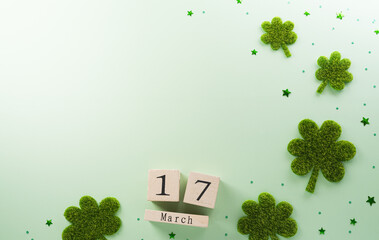 Happy St Patrick's Day decoration concept made from shamrocks ( clover leaf) and wooden calendar on...