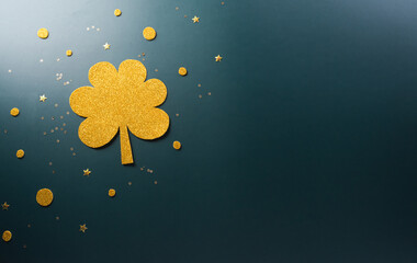 Happy St Patrick's Day decoration concept made from shamrocks ( clover leaf) on dark background.