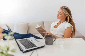 Thinking, planning or graphic designer woman reading notebook for creative research, web strategy or branding. Startup office or serious girl employee at desk working on SEO report, notes or journal.