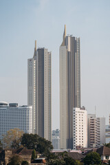 The iconic sharp edges of Bangkok's towering skyscrapers piercing the sky.