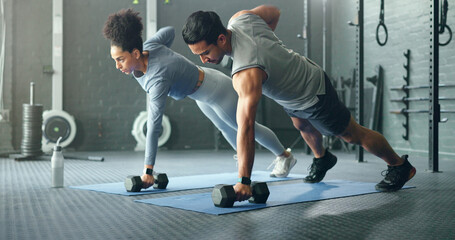 Fitness, gym and couple plank with weight dumbbell for workout, strength and training lifestyle....