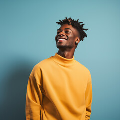 Obraz premium African American young man standing with light blue background, cheerful and optimistic.