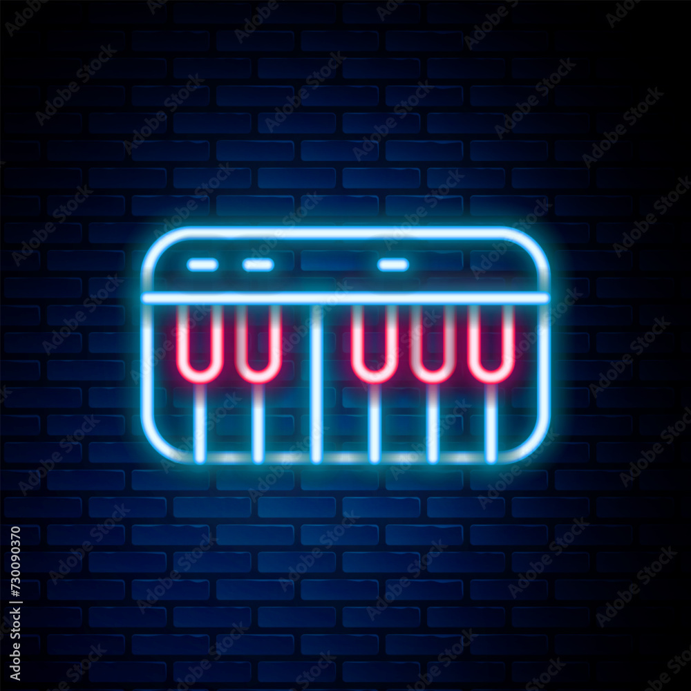 Sticker glowing neon line music synthesizer icon isolated on brick wall background. electronic piano. colorf