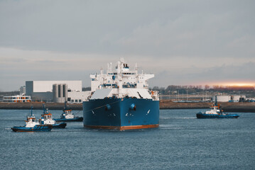 LNG Tanker Mooring In The International Trade Port. Gas Transportation Facility. Natural Gas...