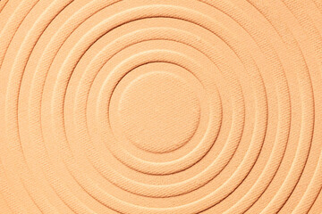Blusher or pressed powder beige textured background
