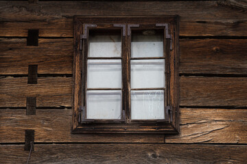 Croatia, October 20,2023 : Rustic style aged window at rural home wall.