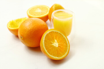 Fresh ripe juicy oranges on light background