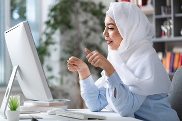 Busy arabian businesswoman wear hijab work on computer