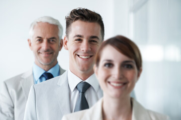 Smiling , friendly group of three businesspeople , and of different age private company staff posing for office portrait. Diverse business partners , team of colleagues professionals working office