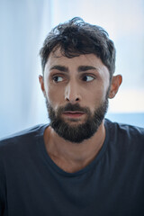 anxious man in everyday t shirt suffering during depressive episode, mental health awareness