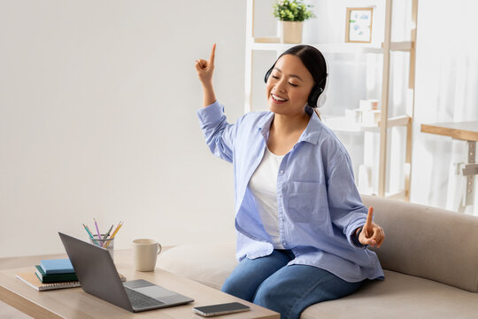 Asian woman listening to music, have break, working from home