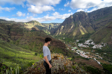 Young man contemplates the landscape. Agaete Valley. Gran Canaria. Canary Islands