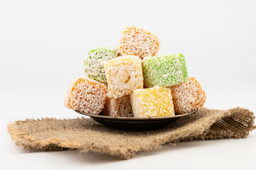 Traditional Turkish delight isolated on white background. Close up.