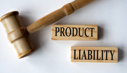 PRODUCT LIABILITY - words on wooden blocks on a white background with a judge's gavel.