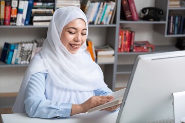 Busy arabian businesswoman wear hijab work on computer