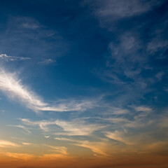 Blue sky with cirrus clouds and bright sun rise.